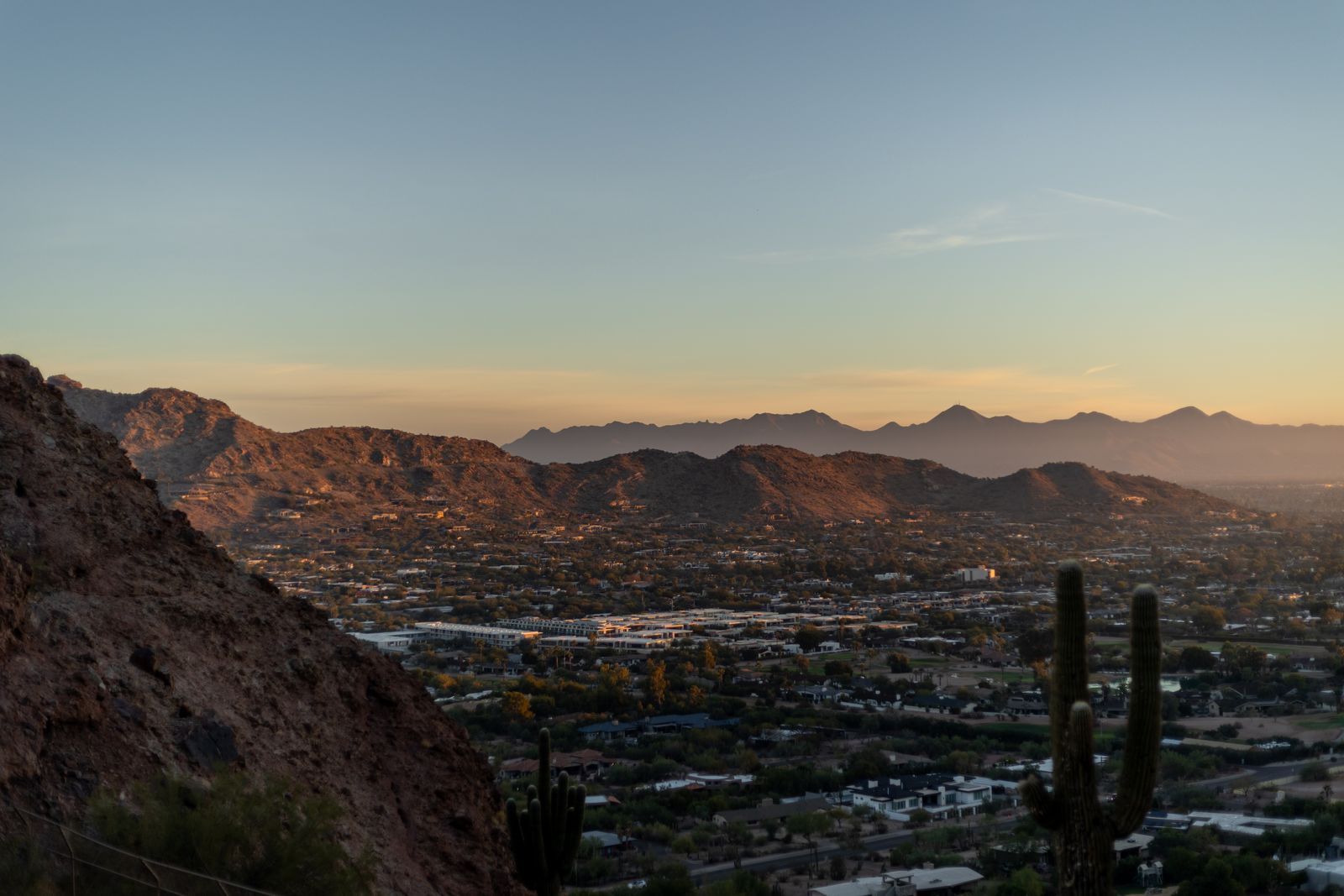 Golden-hour view of the Phoenix valley and desert mountains from Camelback Mountain